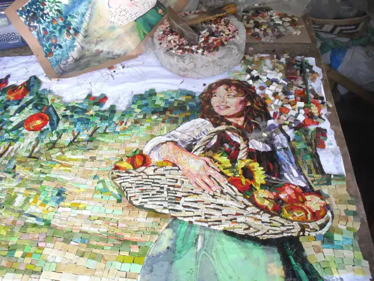 Kitchen backsplash mosaic of women walking through a Orchard work in progress