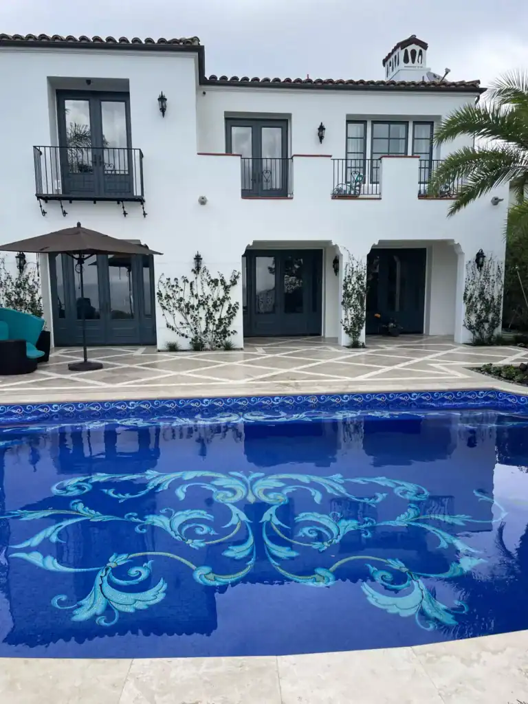 Mosaic pool with intricate blue floral design, handcrafted by Southern California mosaic artist.